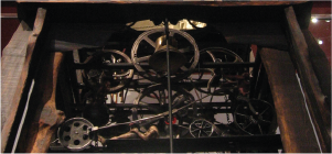 cogs and wheel of a large mechanical clock