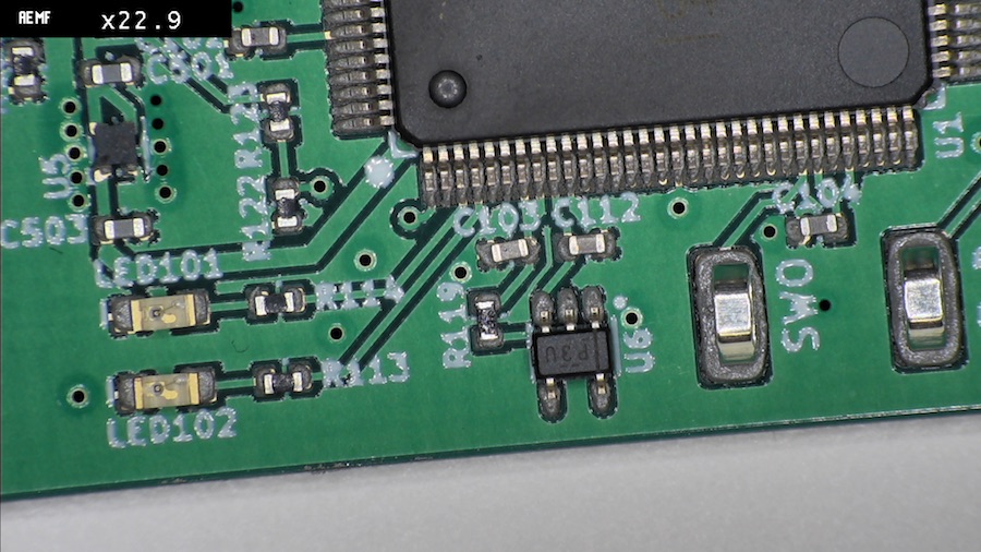 Detail shot of the microcontroller sitting in solder paste
