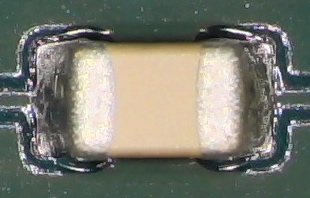 An SMD capacitor soldered to a board