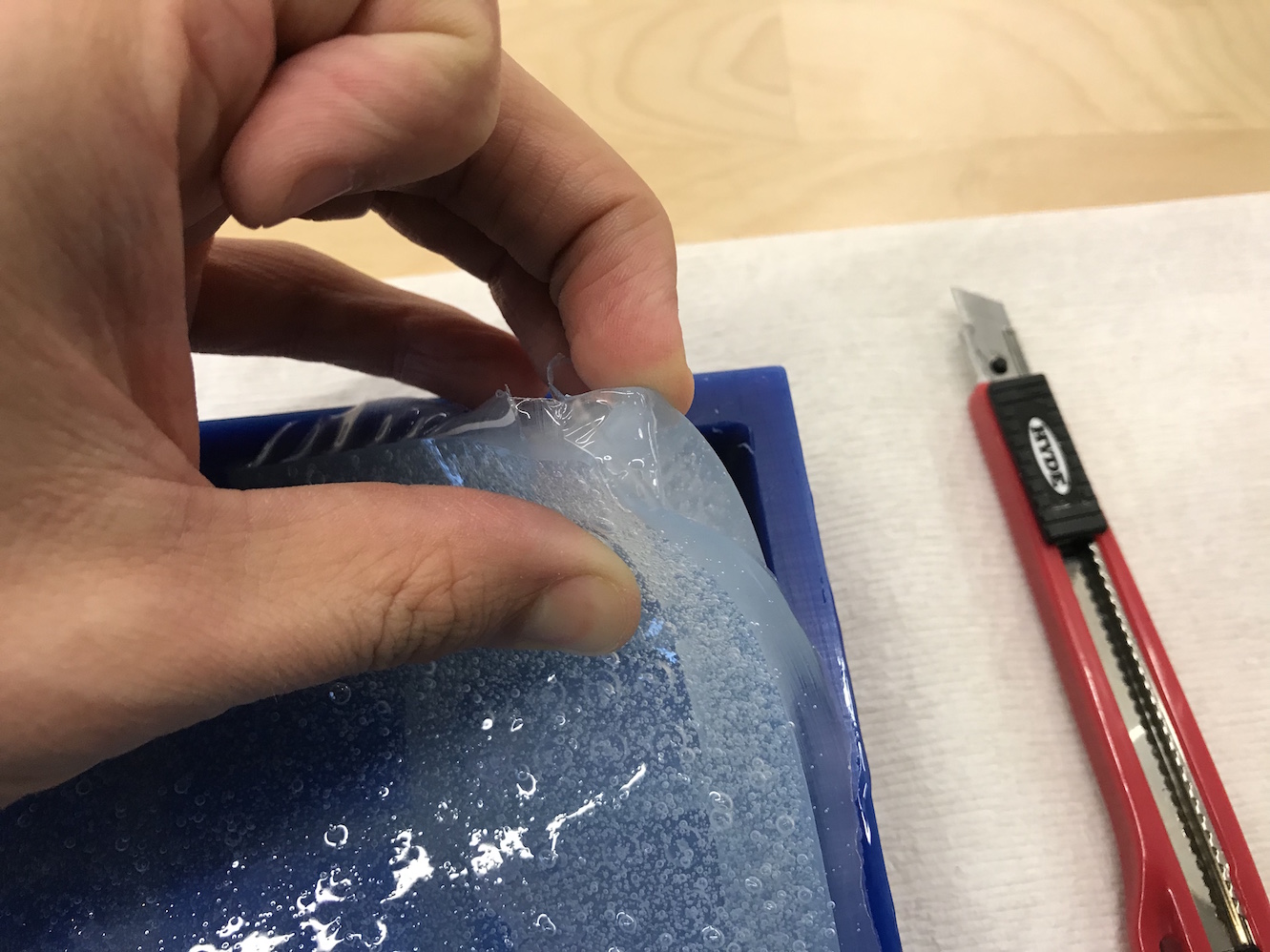 carefully pulling out the silicone