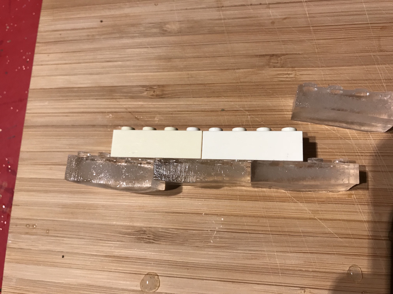 Lego ice cubes interlocked with plastic bricks