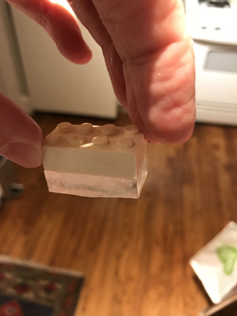 Lego ice cubes interlocked with plastic bricks