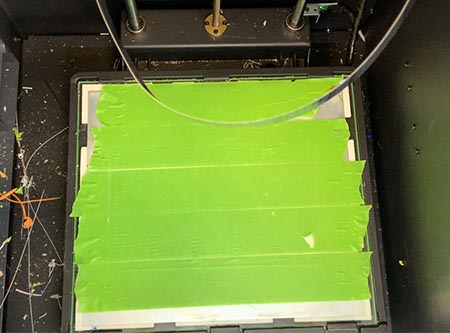the heated printerbed with green masking tape