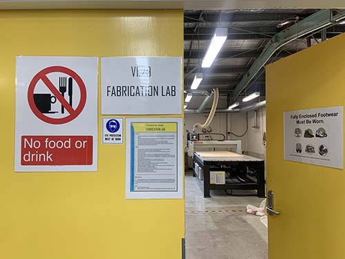 Safety signage at the entry door of the CNC router room