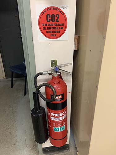 Fire extinguisher located and checked for last test date