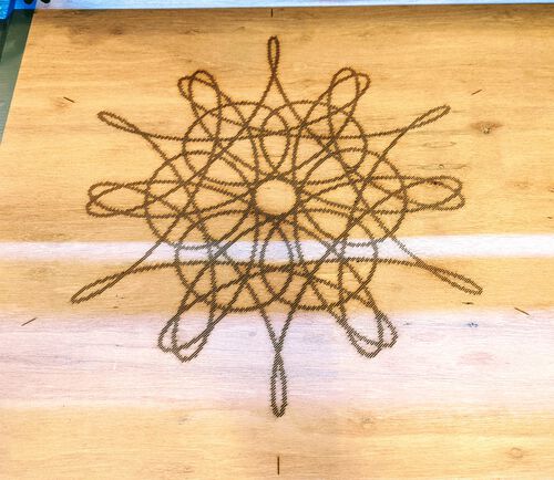 The spirographs hatched into the wood