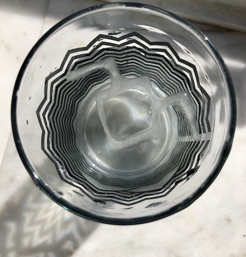 Melting Ice Cube in Glass