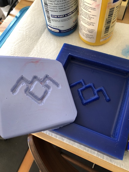 Silicon mold with Twin Peaks symbol
