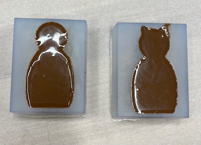 Melted chocolate in silicone molds