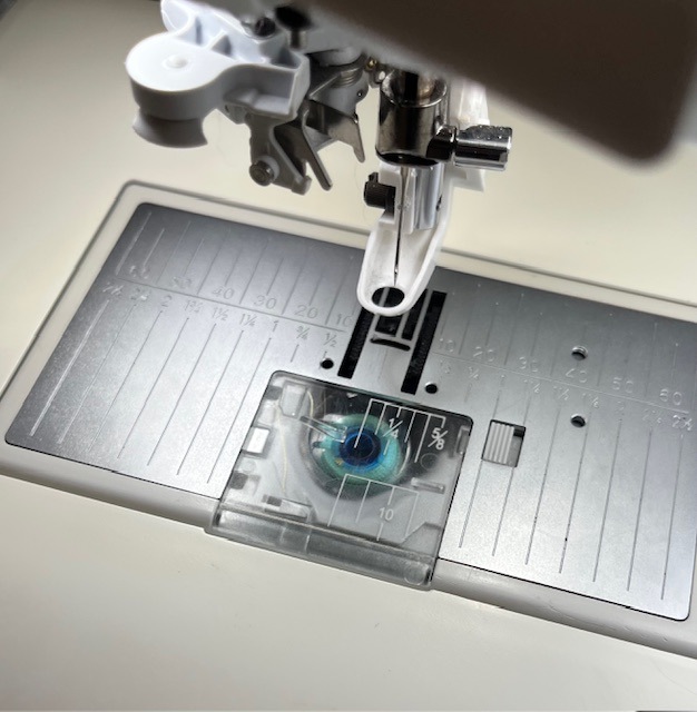 Bobbin loaded into the embroidery machine