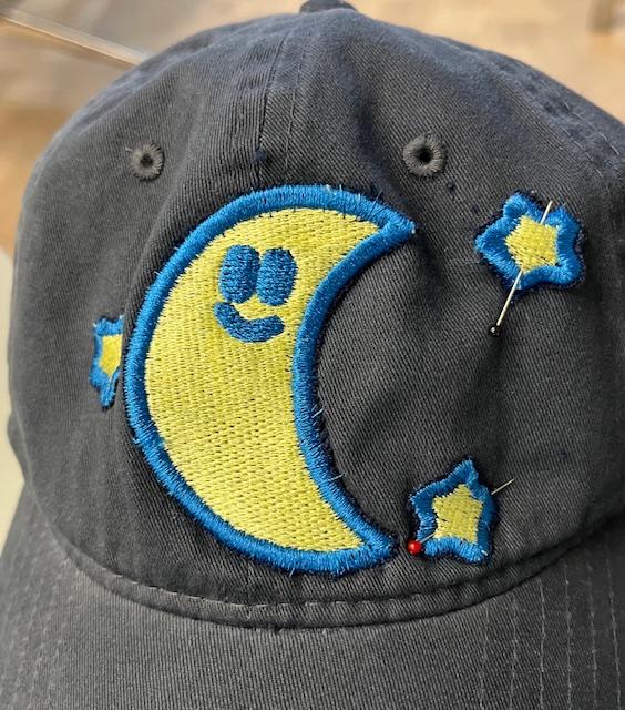 Stars pinned to baseball cap