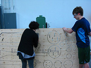 Us cutting out the parts.