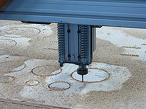 The machine cutting the circles