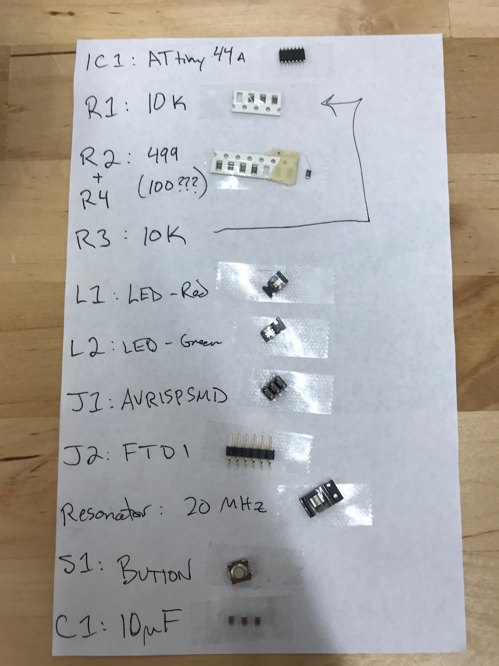 components taped to a sheet of paper