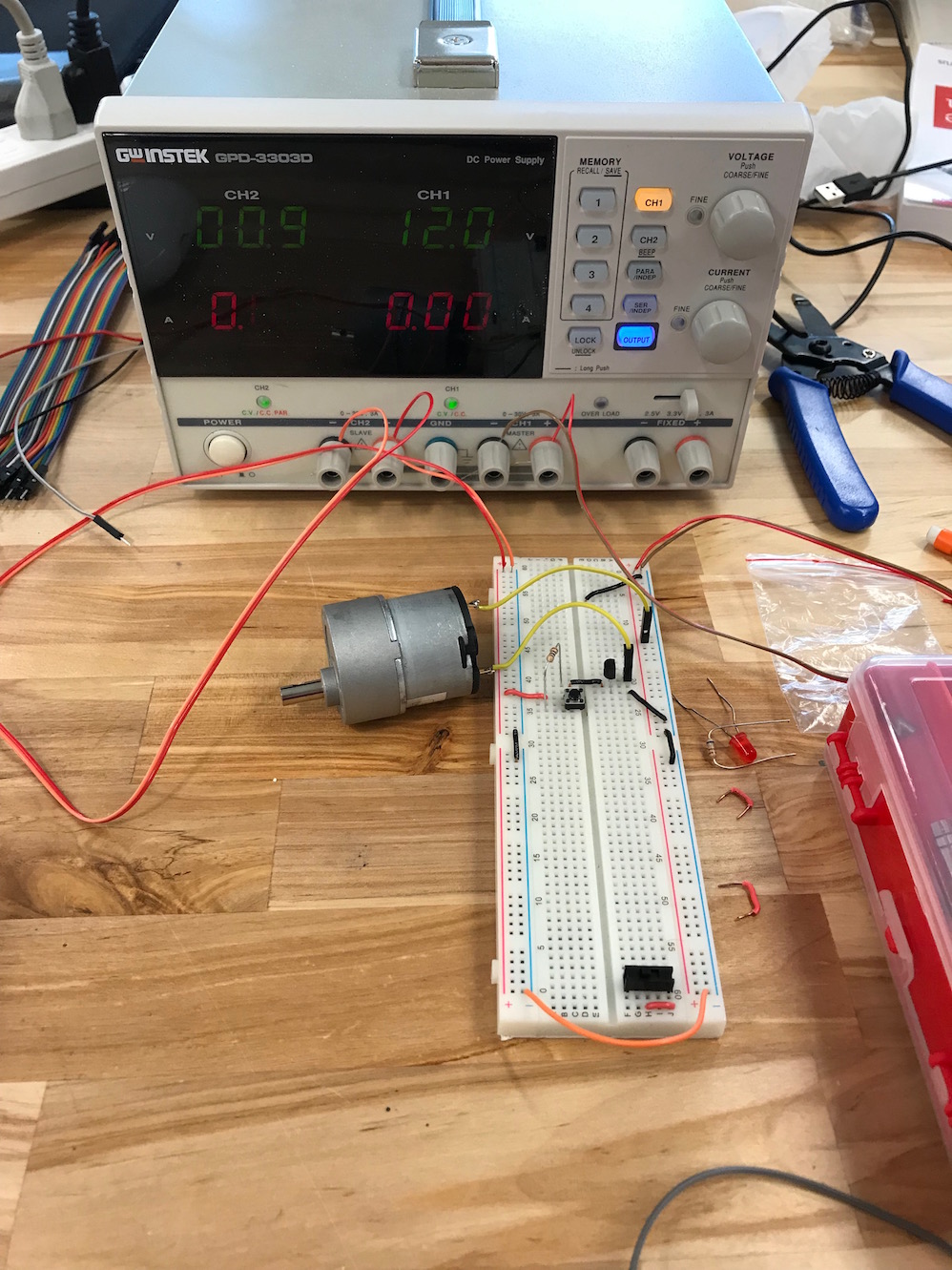 DC motor, breadboard, ad power supply