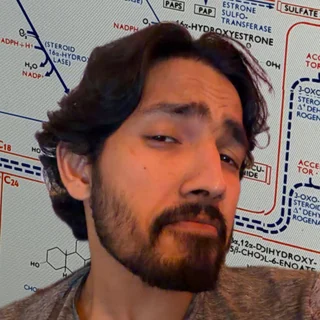 Abel Tomy in front of a steroid metabolism pathway chart