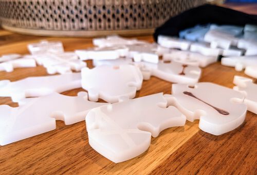 Puzzle pieces from ±5mm thick milky white acrylic