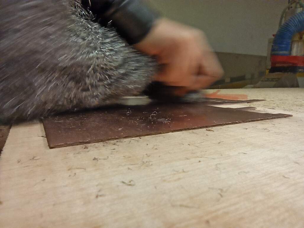 Image of steel wool cleaning the board to mill