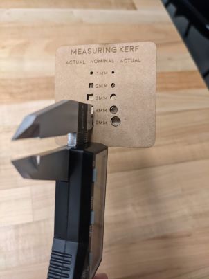 Using a Caliper for Kerf Tests for Wheaton's Glowforge Pro w 1/8 inch cardboard