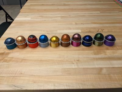 The rainbow of capsule holders matching the capsules
