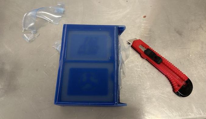 Cutting excess silicone