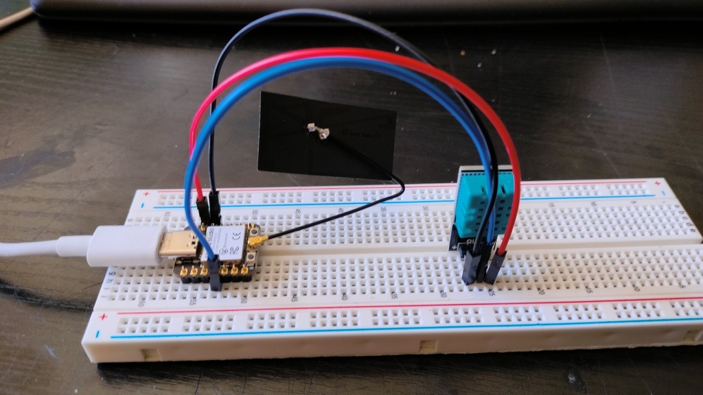 XIAO ESP32C3 with a DHT11 sensor on breadboard