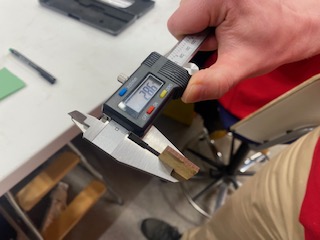Measuring material thickness