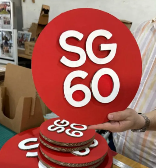 Close view of the layered red SG60 heart sign before installation