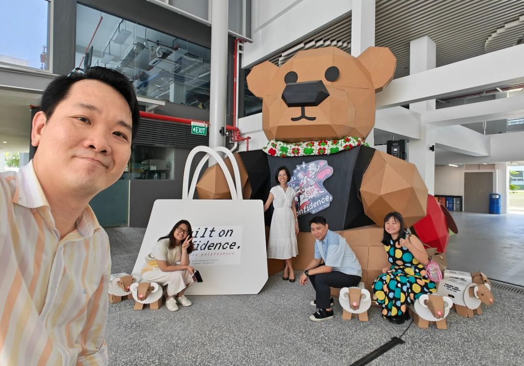Project team posing with the bear installation before transport to the event