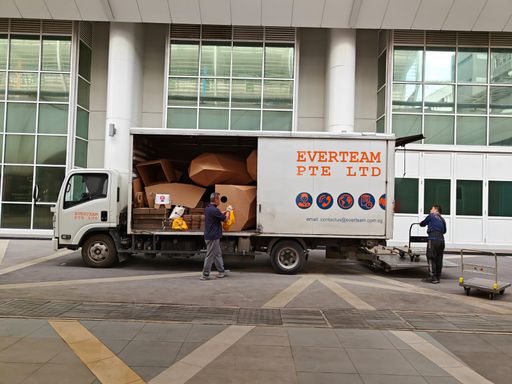 Delivery truck open beside Ngee Ann City during installation move-in
