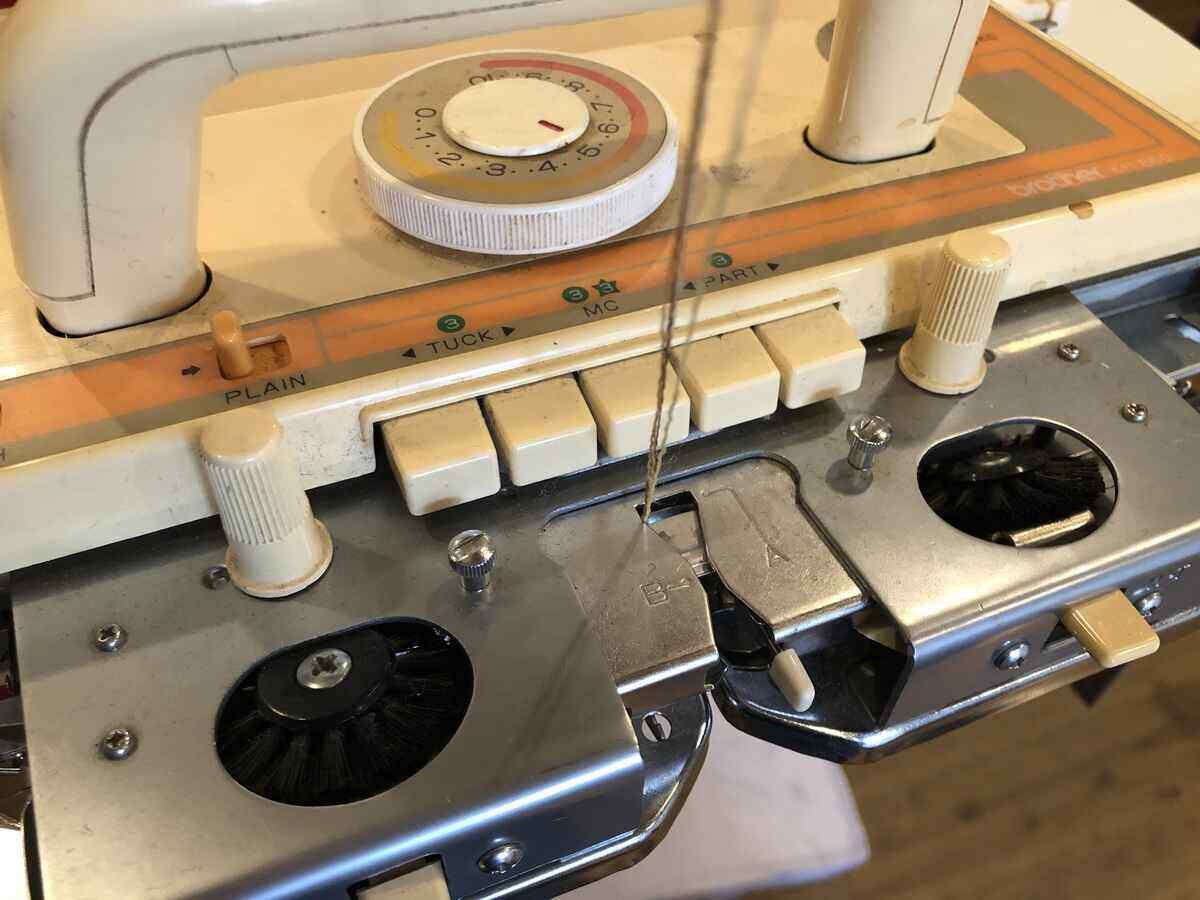 A Brother KH860 Knitting Machine with row counter, punch card
