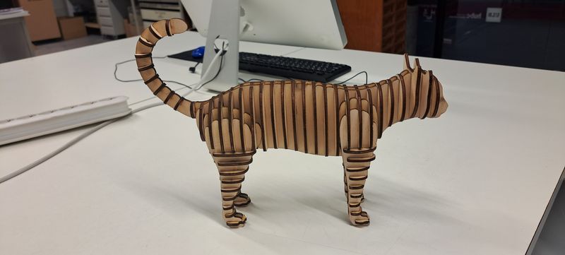 Picture of a 3D wooden cat puzzle assembled.