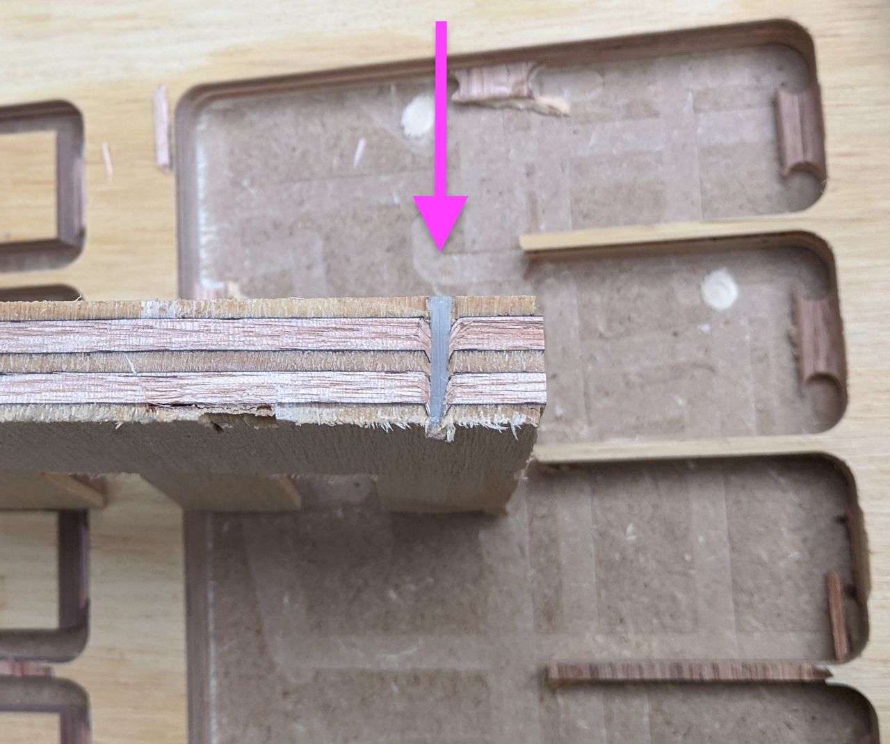 Cross section of composite nail carved by tool.