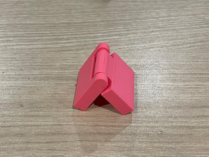 Final 3D printed hinge in pink PLA