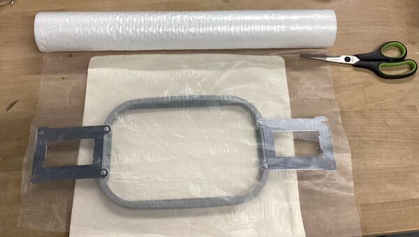 Stabilizer material with scissors and hoop frame