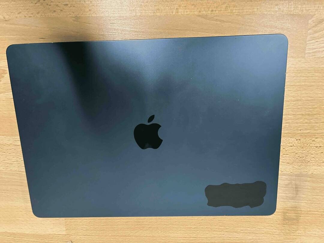 Black vinyl background applied to the laptop.