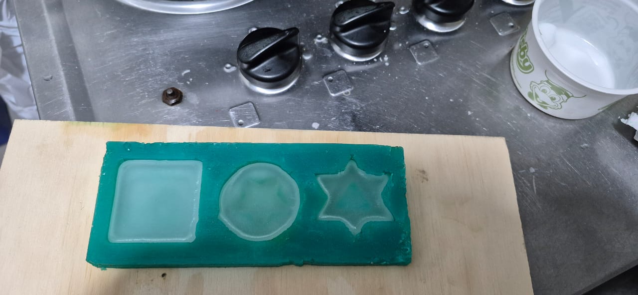 Pouring paraffin wax into silicone mold