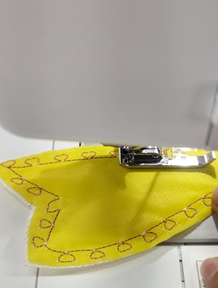 Heart pattern stitching on bow