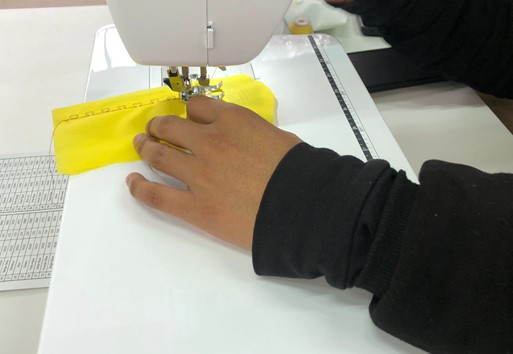Guiding the fabric manually