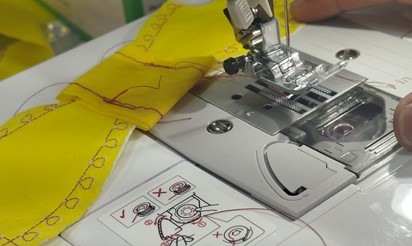 Stitching the bow's center band