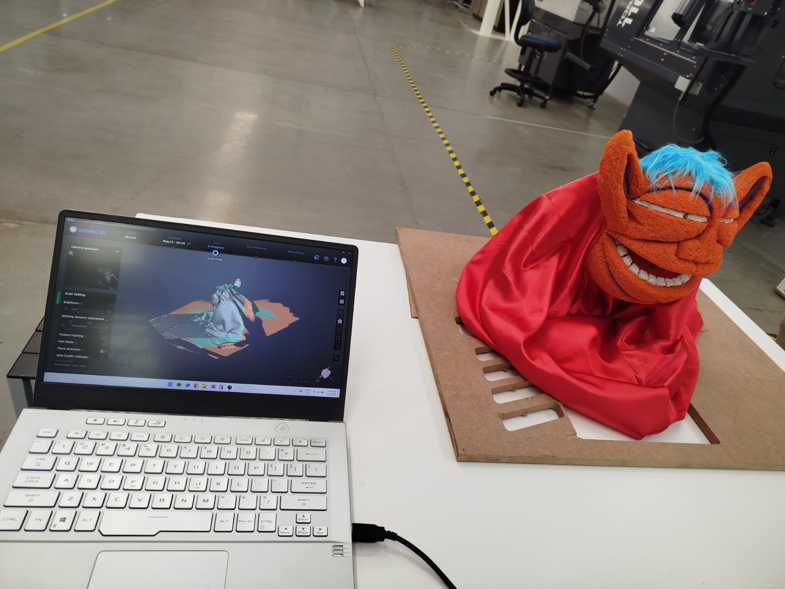 Scanning progress with partial mesh visible