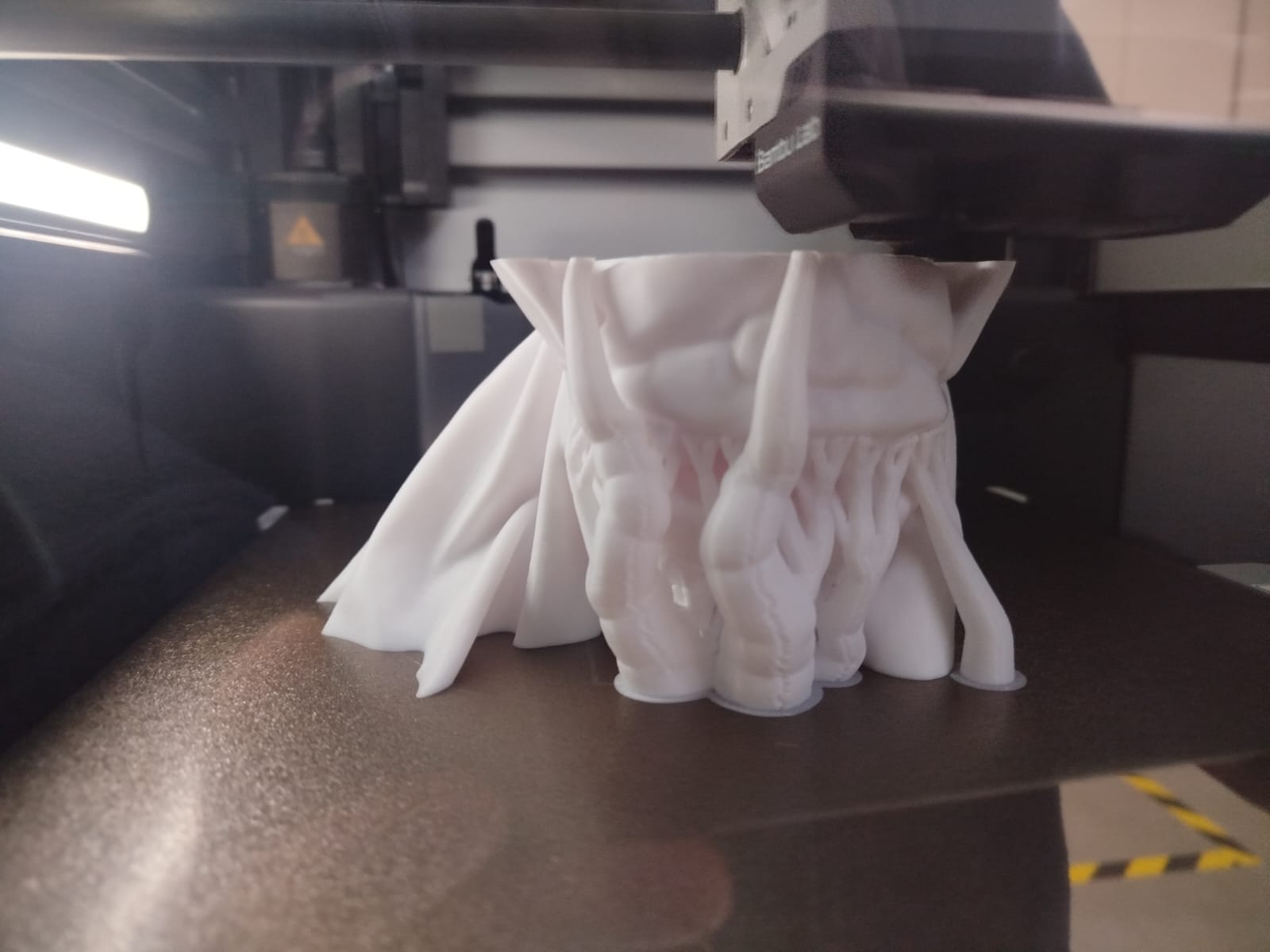 Model mid-print with supports visible