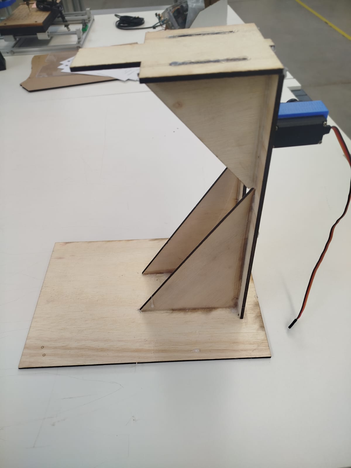 Side view of the wooden puppet support structure with mounted servo