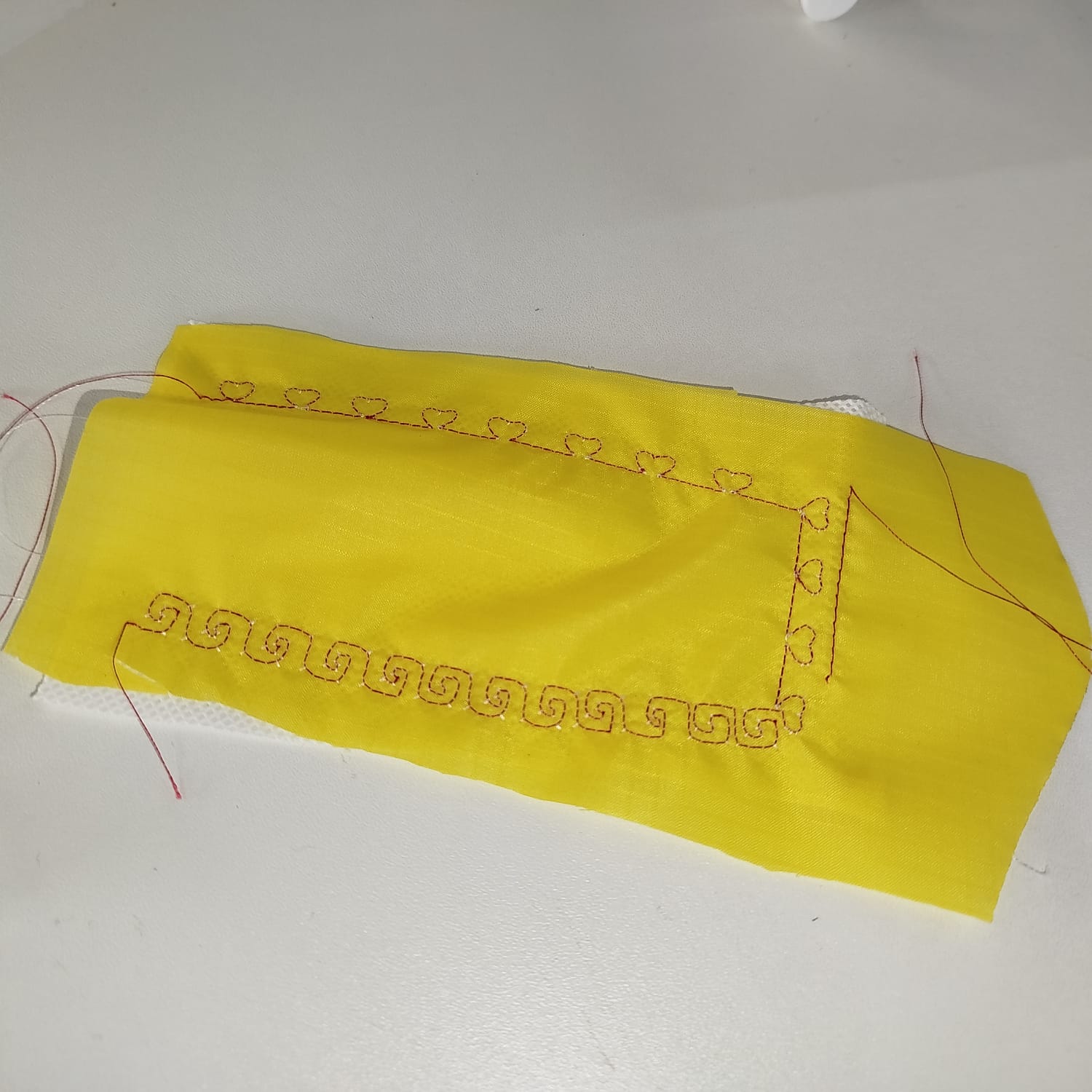 Successful test with decorative stitches on yellow fabric