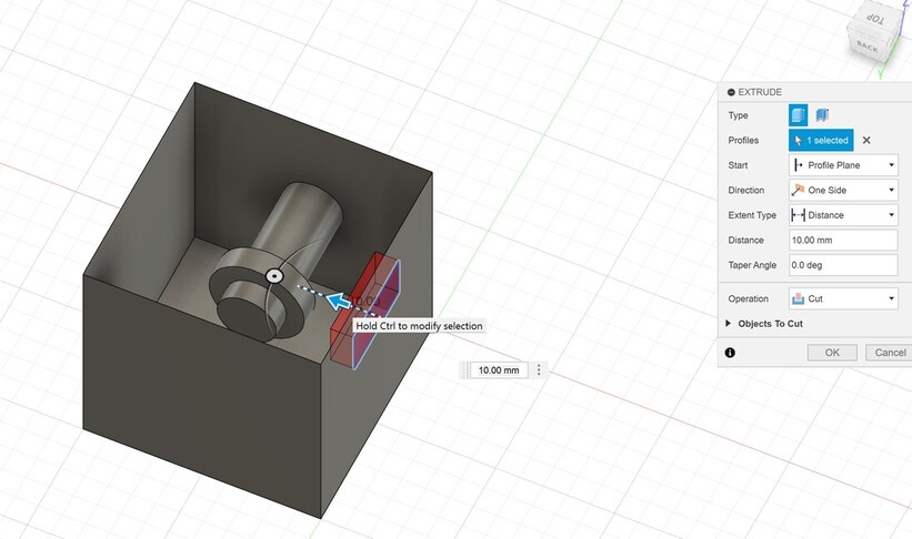 Screenshot of Autodesk Fusion. Cutting hole in box using extrude tool