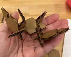 A crab made out of cardboard triangles and diamonds