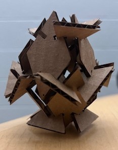 An egg made out of cardboard triangles and diamonds