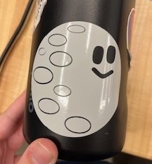 Cartoon moon sticker on a water bottle