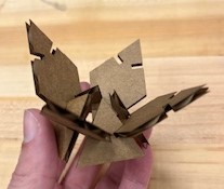 A lotus made out of cardboard triangles and diamonds