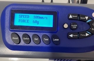 Control panel on vinyl cutter showing force and speed settings